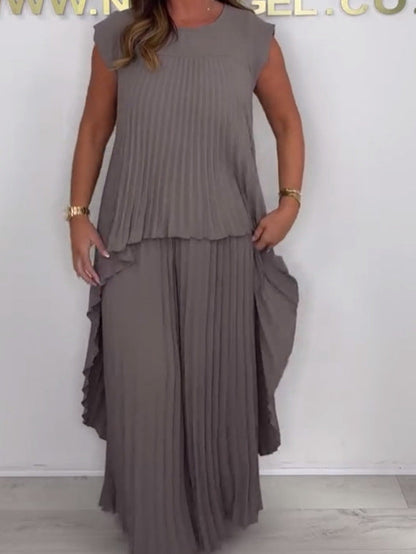 💖ULTIMO GIORNO DI SCONTO DEL 50%💖Completo composto da top midi irregolare a maniche corte plissettato e pantaloni a gamba larga con elastico in vita di Laney✨